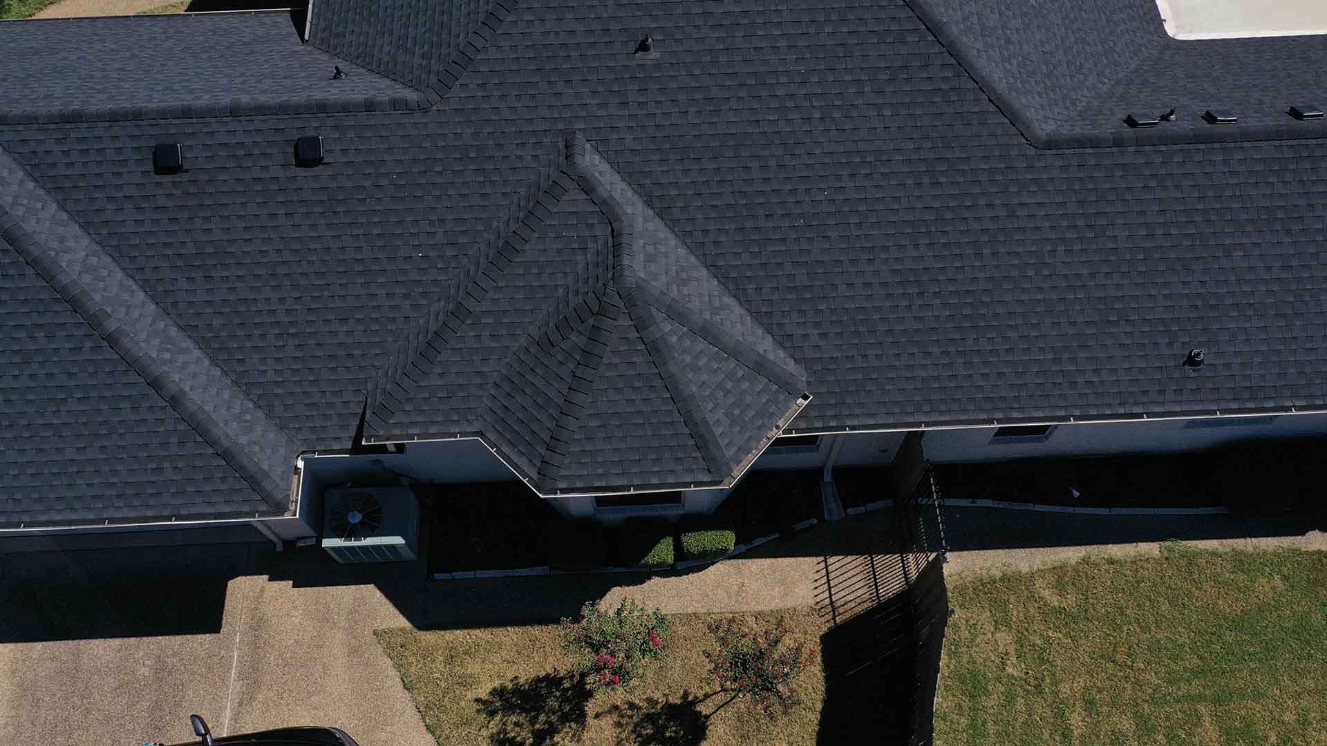 Aerial drone view of a completed roofing project by Amos Roofing in Waco, TX