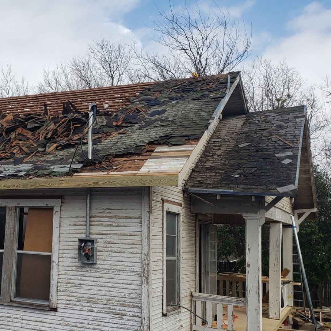 Storm-damaged roof assessed for an insurance claim