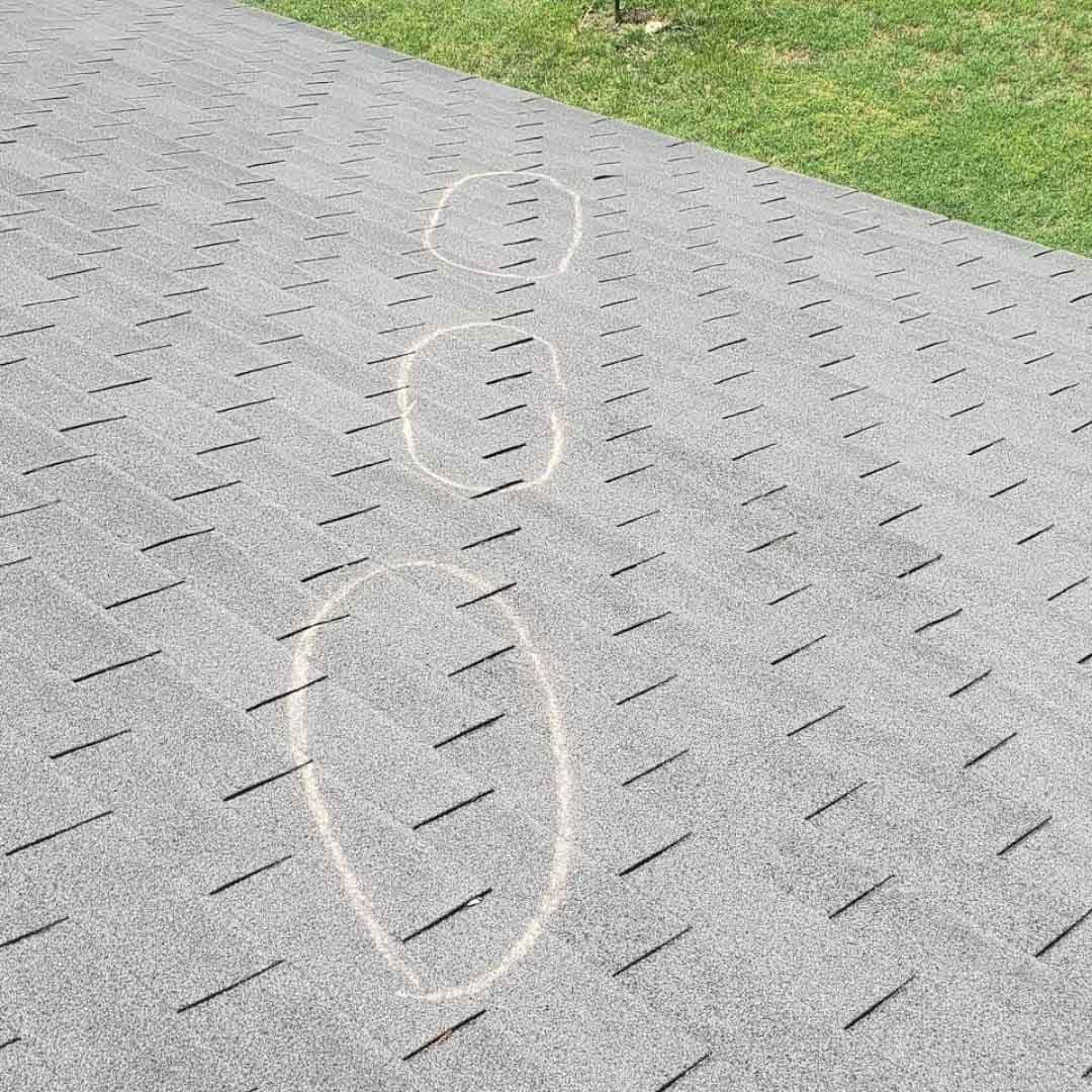 Roof inspection in progress by Amos Roofing